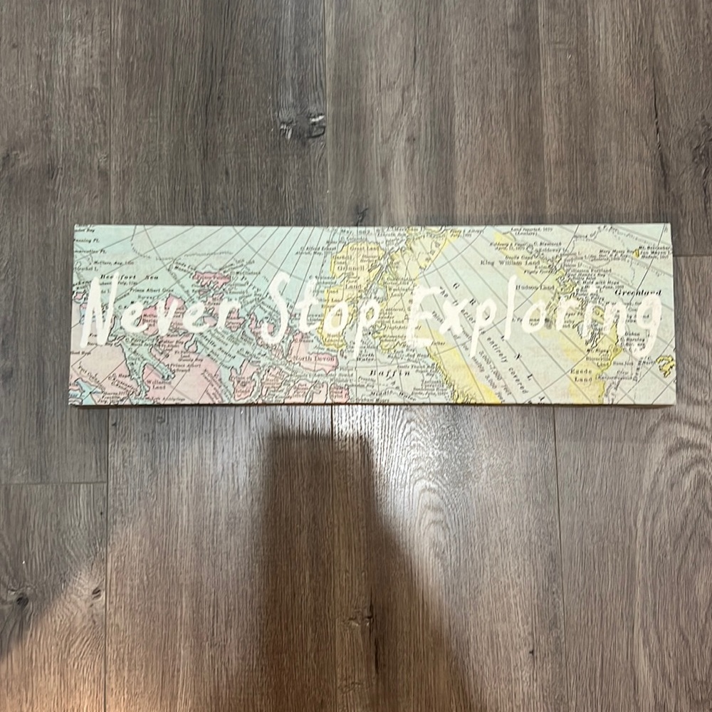 “Never stop exploring” sign
